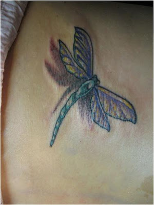Colorful dragonfly tattoo design on the back