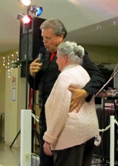 Denny singing to one of the ladies