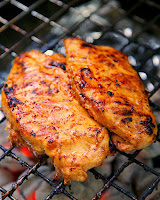 Orange Sriracha Grilled Chicken Recipe - chicken marinated in bbq sauce, mustard, Sriracha, honey and orange juice. Sweet, smokey and a tad bit spicy. SO good! Tons of great flavor and super juicy. We doubled the recipe for leftovers.