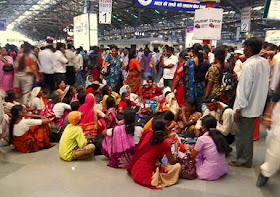 crowd of women at a railway station in India