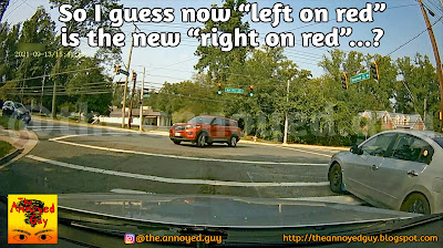 Red SUV making an illegal left turn on a red light