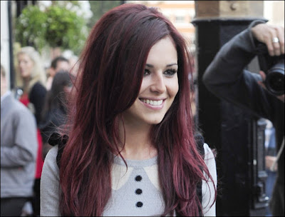 black hair with red underneath. Cheryl Cole and red hair would