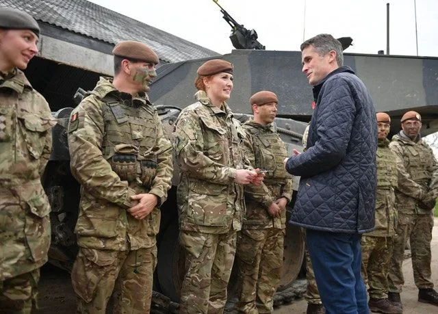 Image Attribute: On a visit to Salisbury Plain on 25 October, during which he announced that all roles in the UK military would be open to women, UK Defence Secretary Gavin Williamson talks to Lance Corporal Kat Dixon, who serves with the Royal Wessex Yeomanry and is the first female tank gunner in her regiment, having joined the army reserves two-and-a-half years ago. (Crown Copyright)