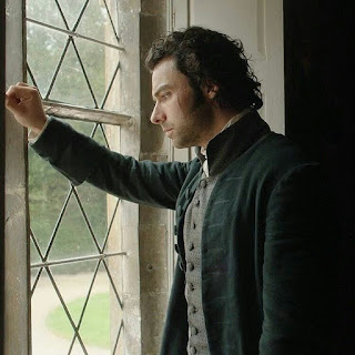 Ross Poldark looking out thoughtfully outside the Trenwith window
