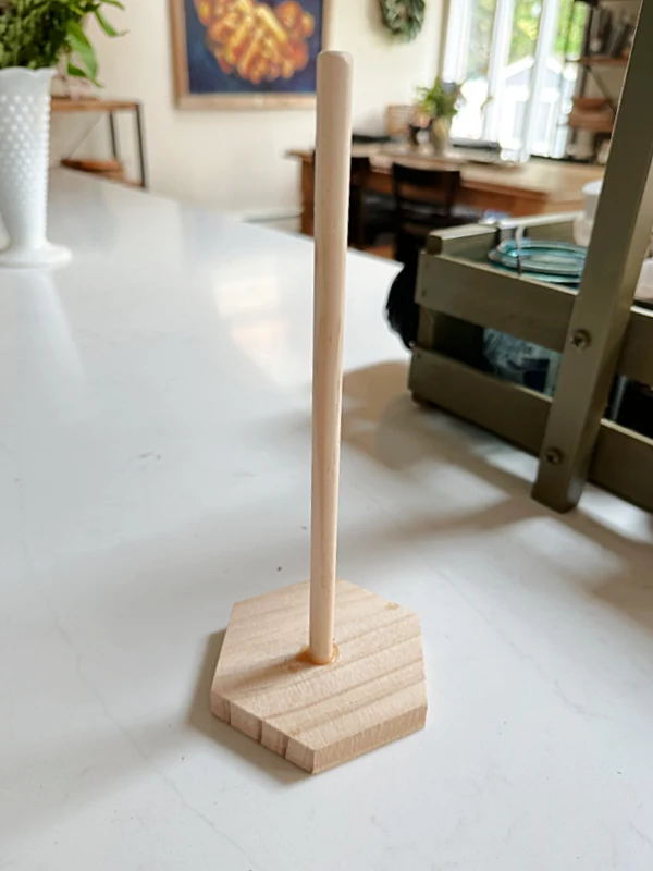 wooden dowel on a base