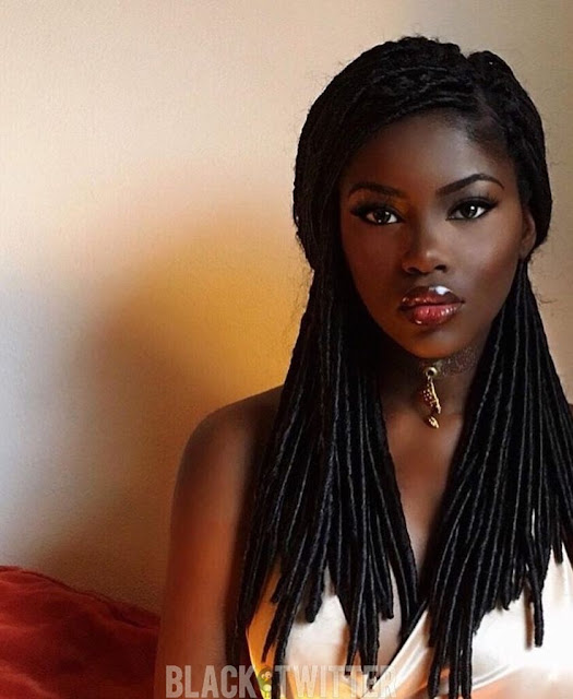 gorgeous dark skin black woman with braids