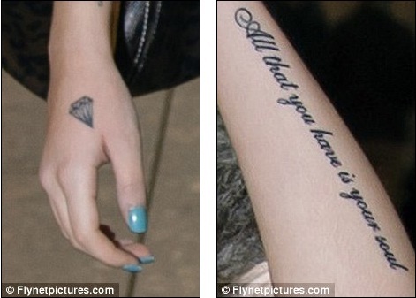 You've been inked Cher now has a diamond on her right hand and song lyrics