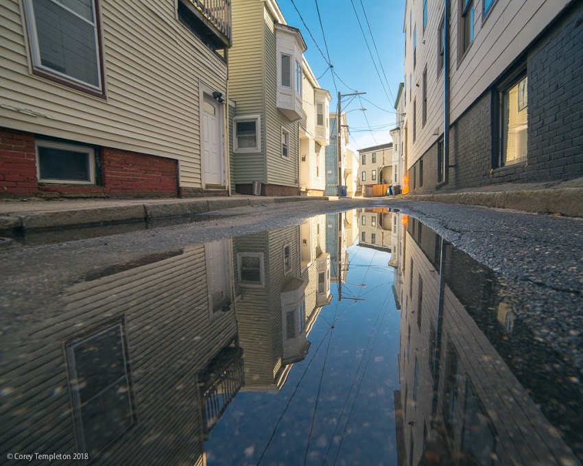 Portland, Maine USA April 2018 photo by Corey Templeton. A leftover puddle on Horton Place, a little street in the West End.