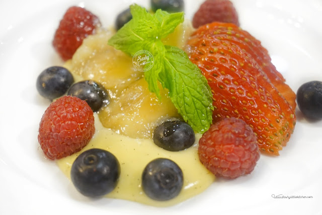 Madagascan Vanilla Bean Pudding, fresh berries and caramelized bananas