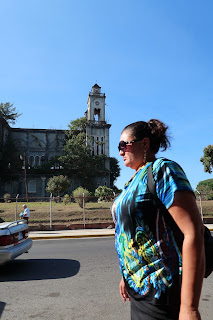 Woman walking by old church in Puriscal