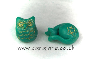 Cute owl and sleeping cat made from polymer clay