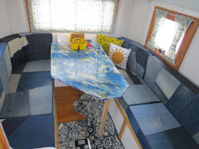 interior of a fiberglass trailer decorated in blue and yellow