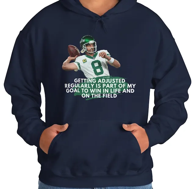 A Unisex Hoodie With NFL Player Aaron Rodgers Slightly Gone Backward to Throw the Duke