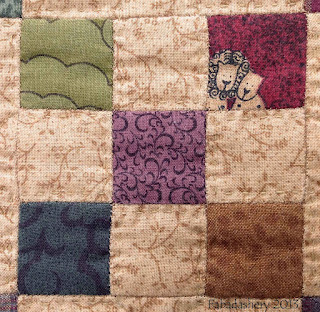 Detail of hand pieced 9 patch block Irish Chain Quilt