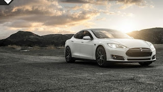 white Tesla model s with mountains in background wallpaper