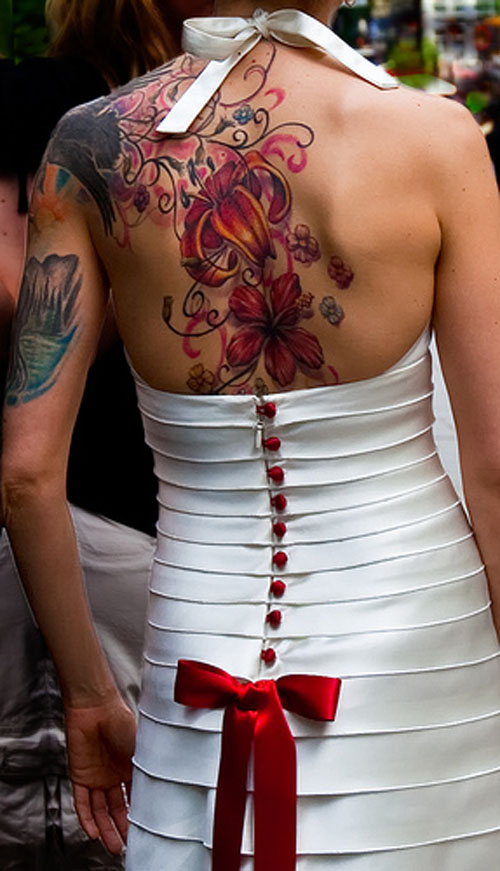 A woman can never go wrong with flower tattoos on her shoulder