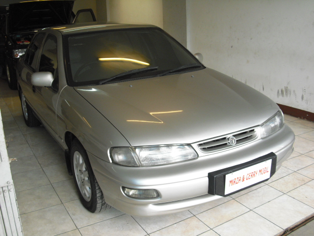 Mirza Gerry Mobil TIMOR DOHC TAHUN 1999 WARNA 