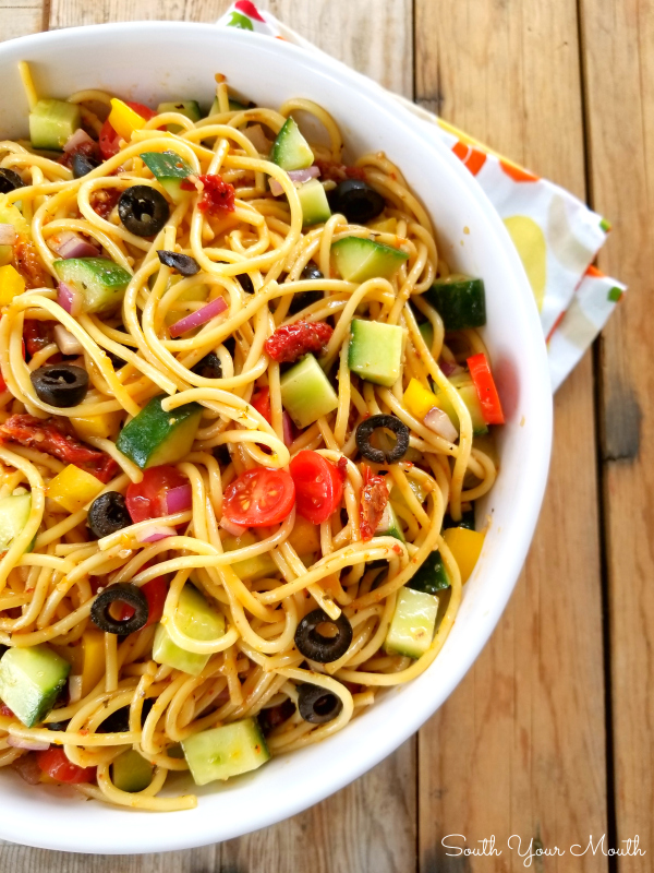 Spaghetti Salad! A unique, delicious overnight pasta salad recipe made with spaghetti noodles, bottled AND dry mix Italian dressing, sundried tomatoes and tons of veggies!