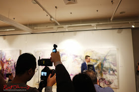 Videoing the opening night - Beyond the Light - Chinese Artist He Zige - Photos By Kent Johnson for Street Fashion Sydney.