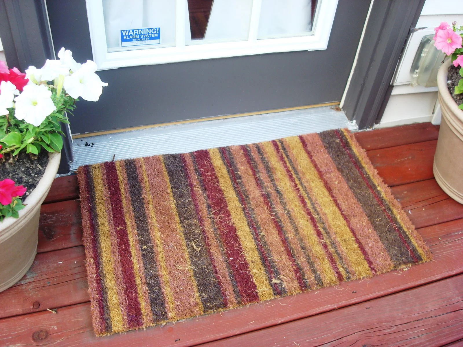 striped outdoor rug warm colors