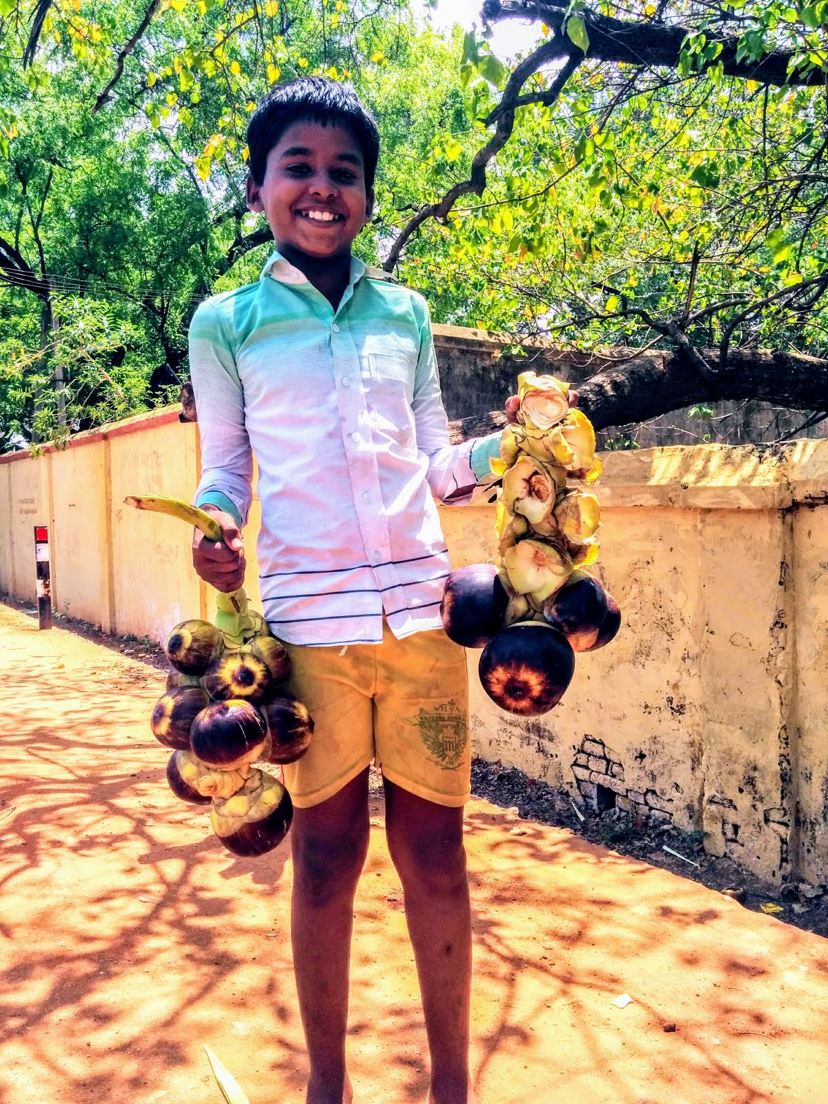 Kid all smiles with his Palm fruit at Kallidaikurichi