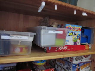 Put Small games and cards in catch-all bins or containers