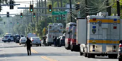 Authorities respond to the scene of a mass shooting at a Dollar General store, Saturday, Aug. 26, 2023, in Jacksonville, Fla. (AP Photo/John Raoux)