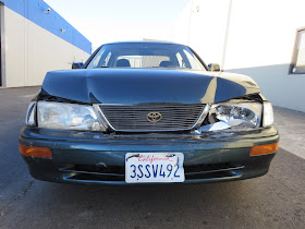 Toyota Avalon with collision damage before repair at Almost Everything Auto Body