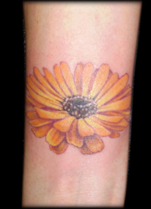 daisy tattoos pics. a blinking daisy tattoo is