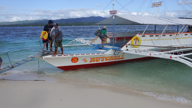 passengers boarding the boat going back to mainland from Canigao Island in Matalom, Leyte