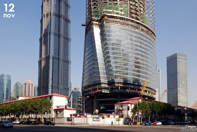 Photo of Shanghai Tower base under construction as seen from the across the street