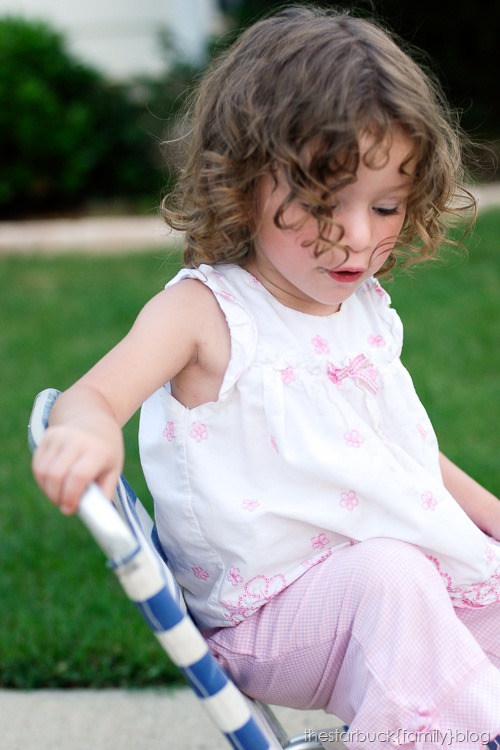 Abby playing with lawn chair and in carport blog-12