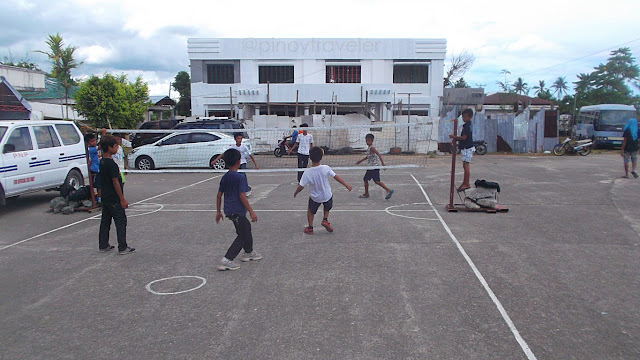 ch9ildren playing sepak takraw in front of the municipal hall of Mayorga, Leyte