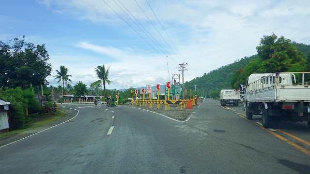 highway fork or Y intersection: right lane goes to Javier town center, left goes to Abuyog
