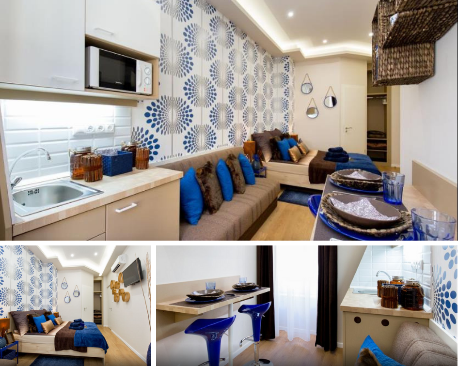 a small apartment with a double bed, sofa bed and small kitchenette