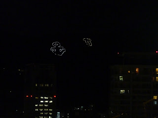 The Ikari Mark on the rokko mountain range as seen from the Kobe Port tower at night. These are massive symbols of an anchor and the Kobe City symbol (which in the mountain looks a bit like pi). They are lit up at night with a heap of lights