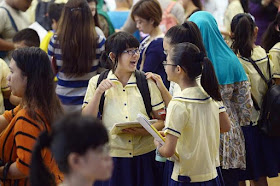 Students getting their PSLE results yesterday at Lakeside Primary School. 98.4% of PSLE pupils qualify for secondary school.