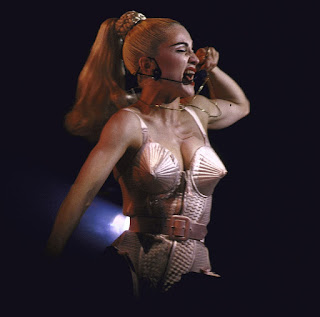 Madonna wearing a cone bra.