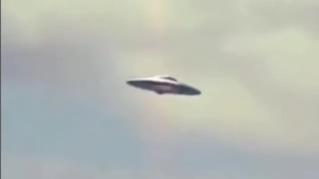 Close up look at the Flying Saucer over people's homes.