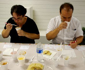 MCC staffers Cheryl Pike and Dan Cook put their discerning noses to work judging the chili.