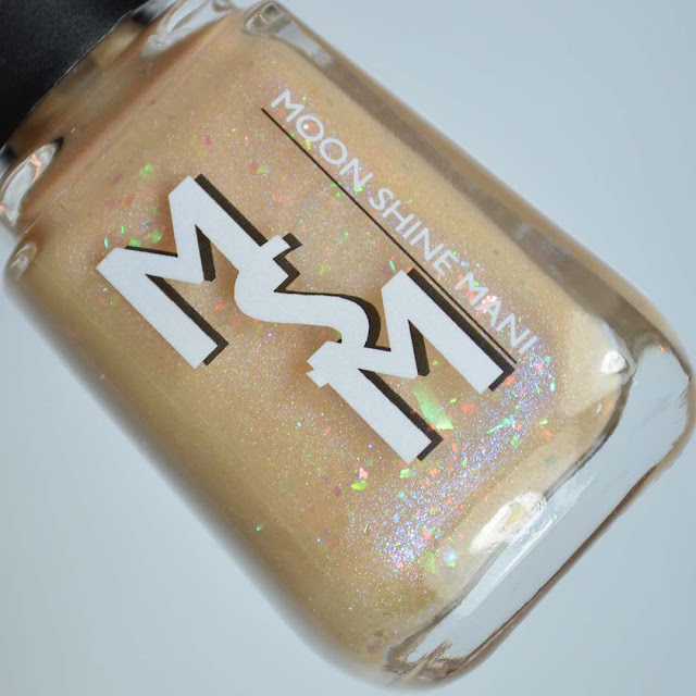 buff creme nail polish with flakies in a bottle