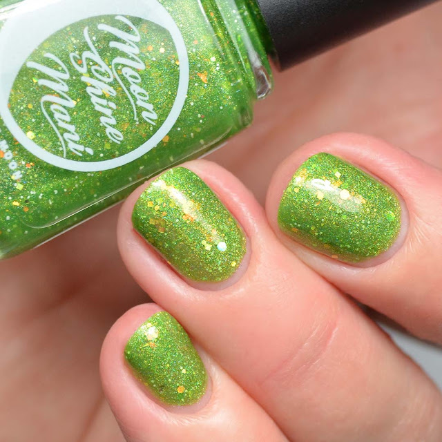 green nail polish with iridescent glitter swatch