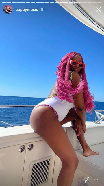 DJ Cuppy Goes On A Boat Cruise In Monaco with Cute Swimsuit Photos