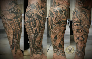 3d tattoo on the leg: alien-like bones and tissues