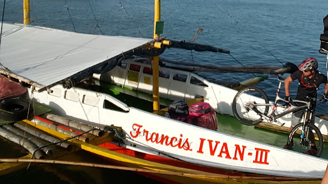 biker loading his bike on M/B Francis Evan III - a boat bound for Guimaras at the Iloilo Ortiz Wharf