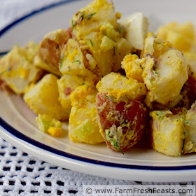 A fresh and pretty side dish for a Spring table, this potato salad combines chive blossoms and hard cooked eggs with red skin potatoes and tangy mustard.