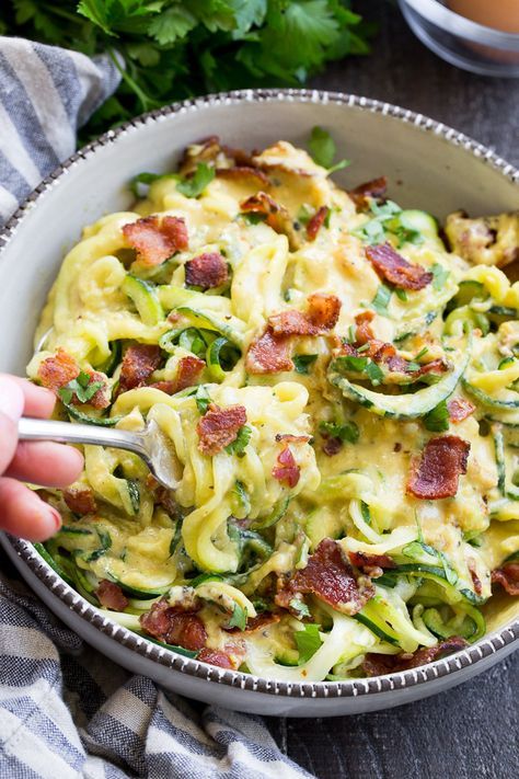 This paleo zucchini carbonara has a savory creamy sauce that you won't believe is dairy free! Tossed with crisp bacon and low carb zucchini pasta, it's a healthy meal you'll want to make over and over again. Paleo, Whole30 compliant, low carb, dairy free.