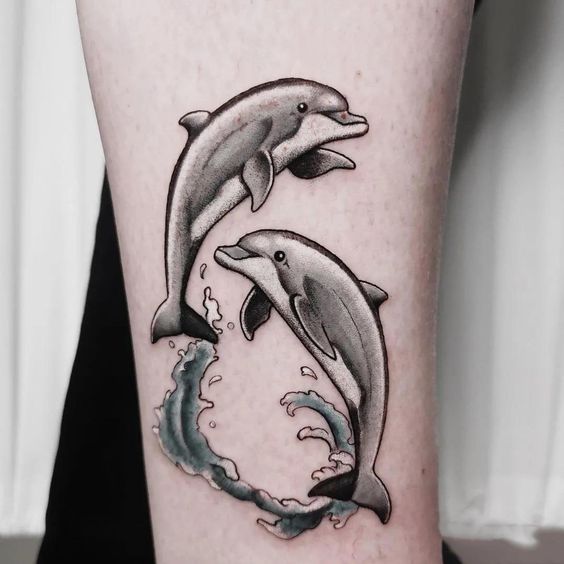 Dolphins-Jumping-on-the-Water-Tattoo