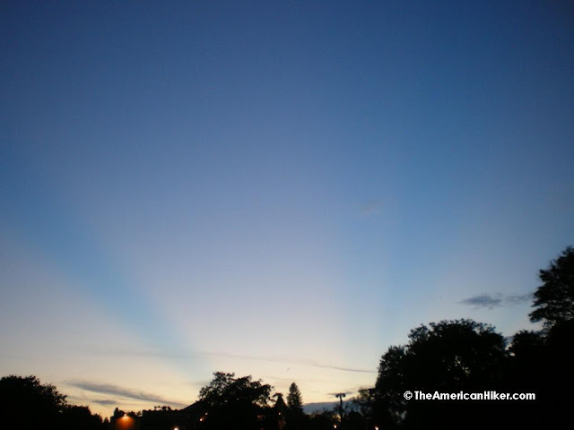 Bright blue rays coming from the sun.  These are not your typical crepuscular rays that you see at dawn or dusk.  Many refer to them as anti-crepuscular rays or "God rays".