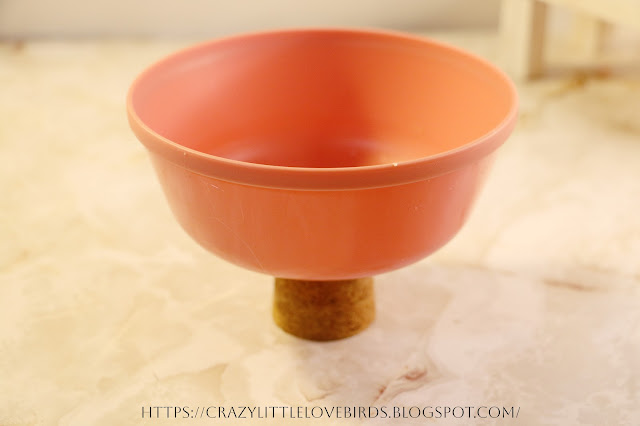 Pink bowl attached to cork